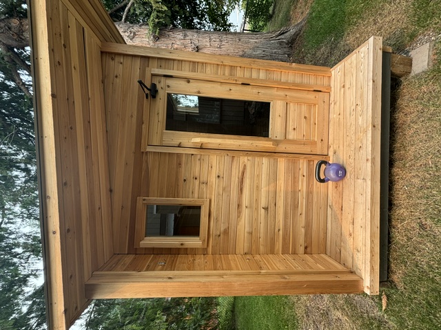 Cedar porch and glass door of the home sauna
