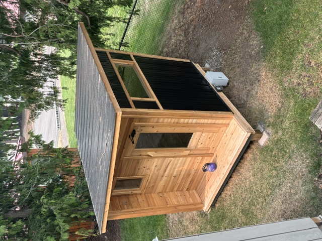 Home sauna seen from above with its sloped roof